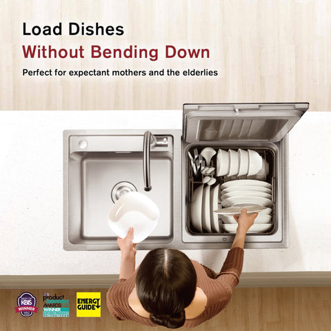 A person places a dish into an elevated SD2F-P3 2in1 In-Sink Dishwasher by FOTILE next to a sink on a kitchen counter. The text reads, "Load Dishes Without Bending Down. Perfect for expectant mothers and the elderlies." Featuring an ergonomic countertop design with stainless steel finish. Various award and certification logos are visible at the bottom. Now Available At Lowe's. A person places a dish into an elevated SD2F-P3 2in1 In-Sink Dishwasher by FOTILE next to a sink on a kitchen counter. The text reads, "Load Dishes Without Bending Down. Perfect for expectant mothers and the elderlies." Featuring an ergonomic countertop design with stainless steel finish. Various award and certification logos are visible at the bottom. Now Available At Lowe's.